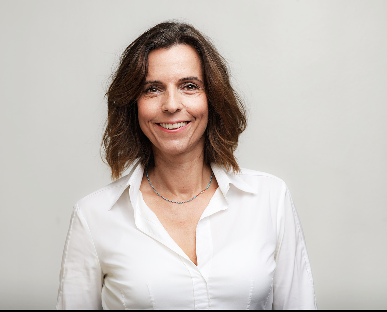 Kathrin Adlkofer is smiling friendly